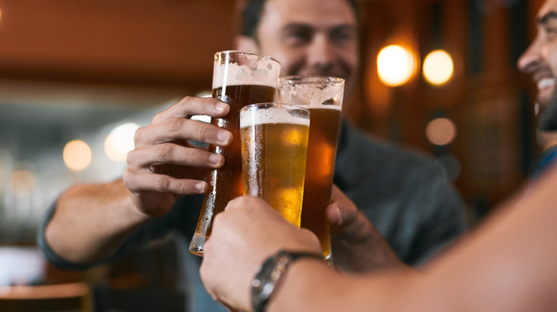 friends cheers with beer