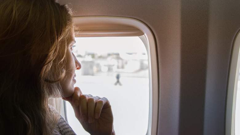 woman airplane window