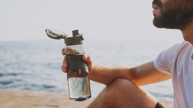 Bearded man by the shore