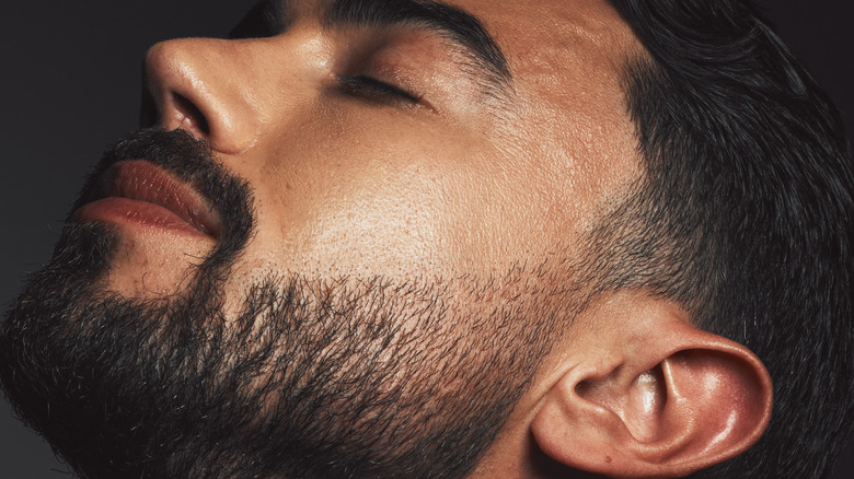 Bearded man with smooth skin
