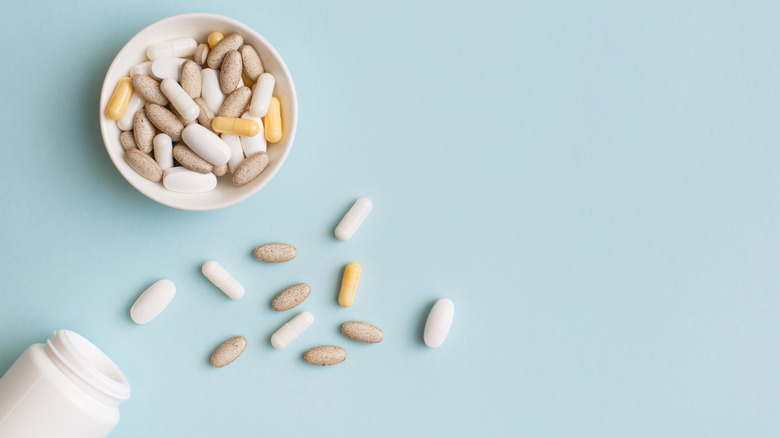 Assorted pills in a white bowl