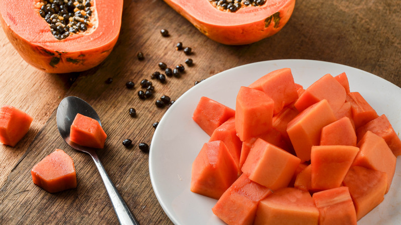 A plate of papaya sits on a table