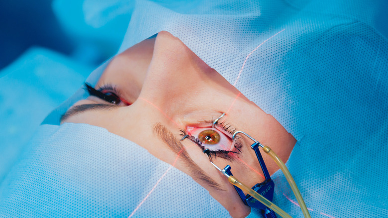 young woman using eye drops