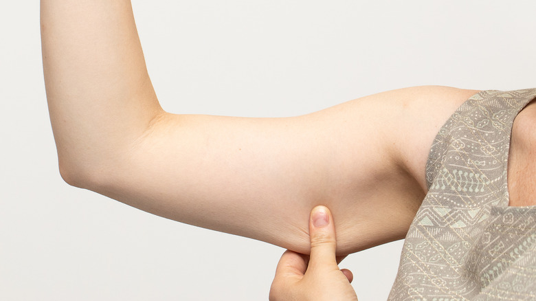 a thin but flabby female right arm