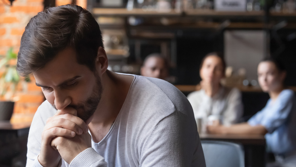 man sitting alone in restaurant