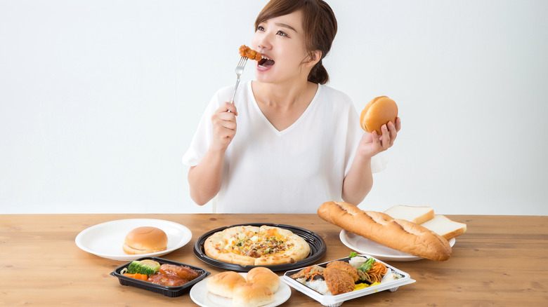 Woman eating junk food