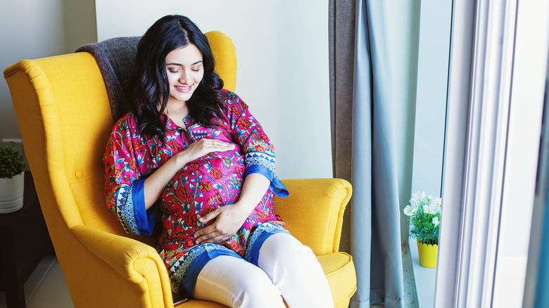 Pregnant woman sitting in chair