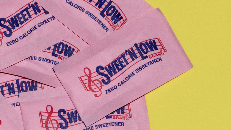 artificial sweeteners on yellow background