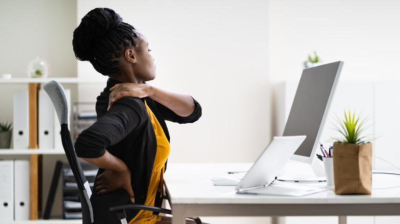 woman office posture pain