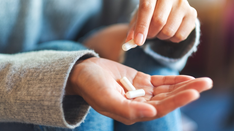 woman holding medication