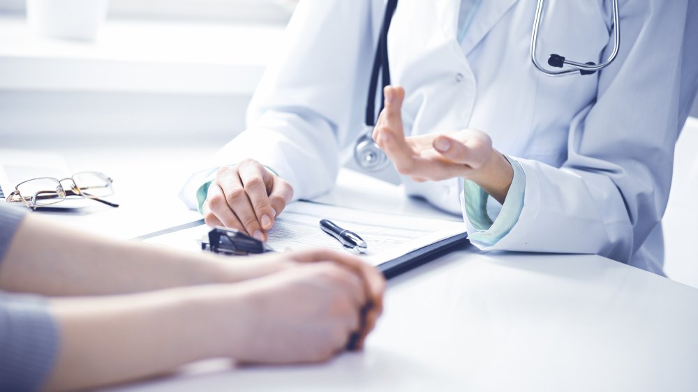 woman talking to doctor