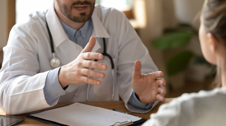 doctor talking to patient