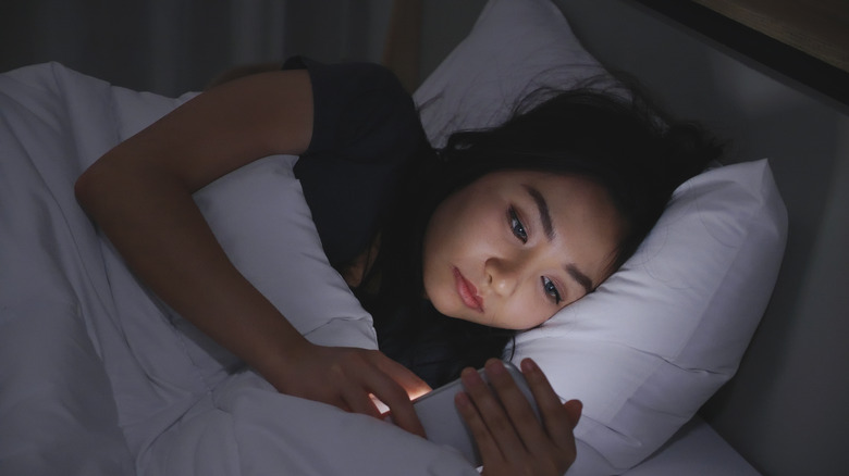 woman looking at phone