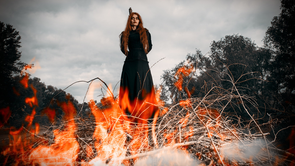 Redheaded witch about to get burned