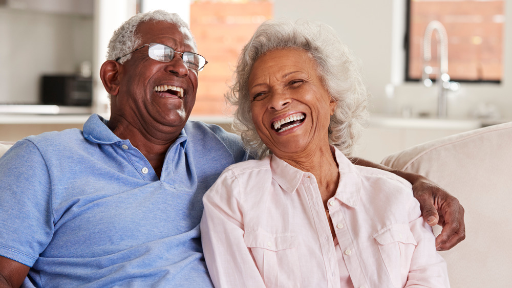 Smiling Senior Couple on Couch