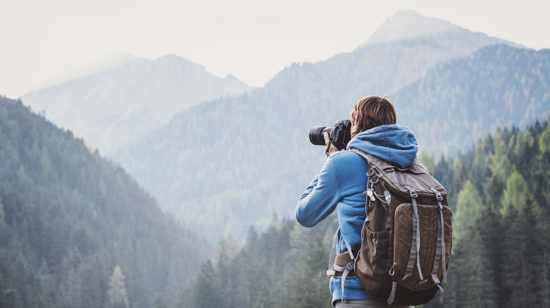 man photograph mountain