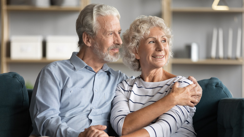 older couple embracing and happy