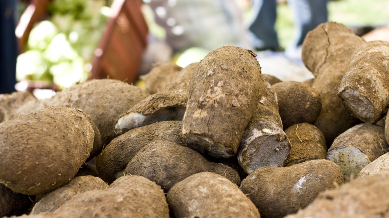 stack of yams at a market