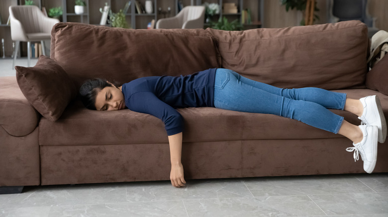 Woman asleep on couch