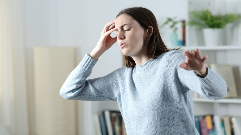 Woman experiencing vertigo