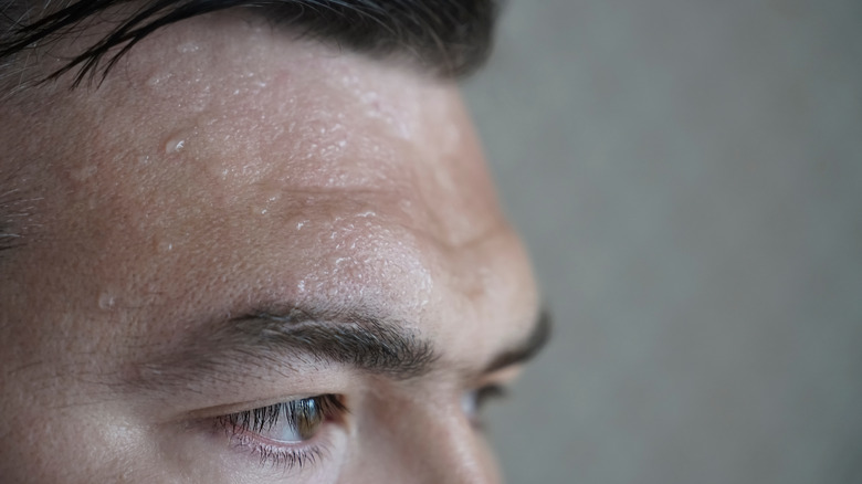 man with beads of sweat