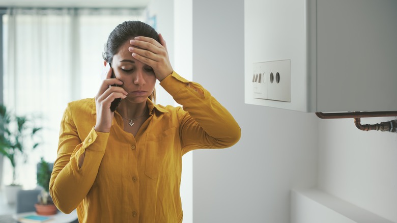 distressed person calling for help on phone