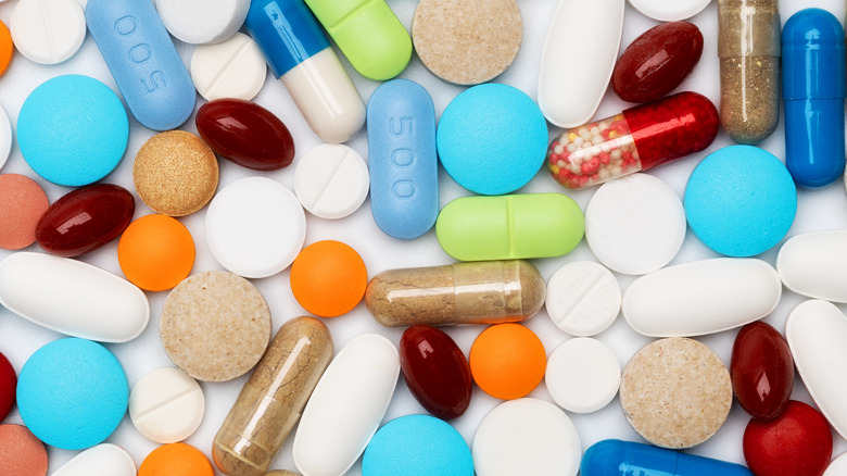 colorful pills on white lab table