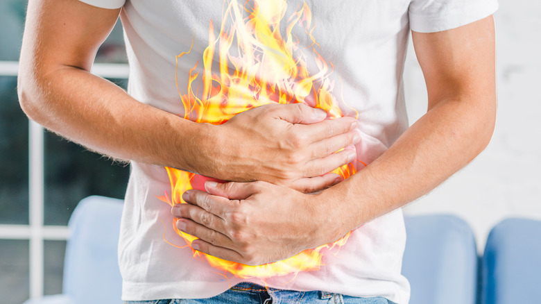 man experiencing stomach pain