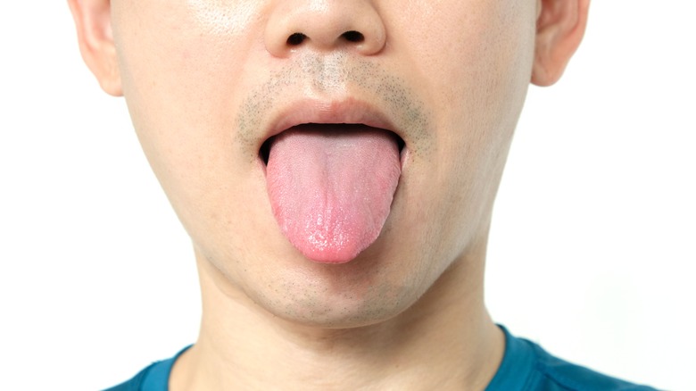 Man sticking out tongue