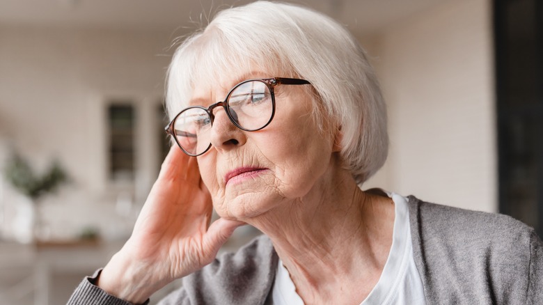 elderly woman with a fixed stare