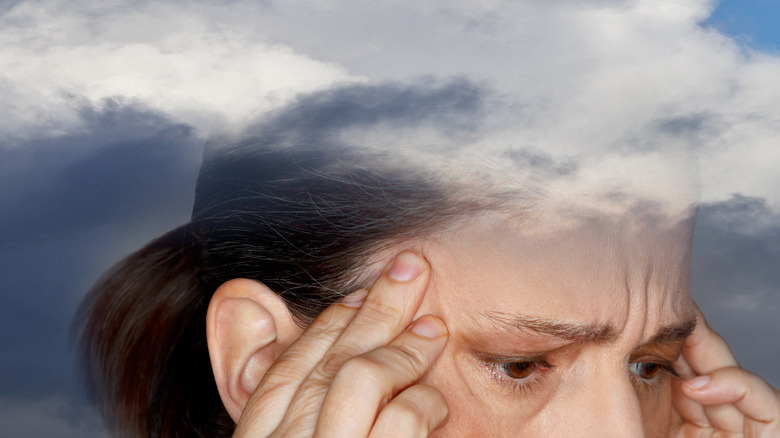 Woman with "fog" floating over head