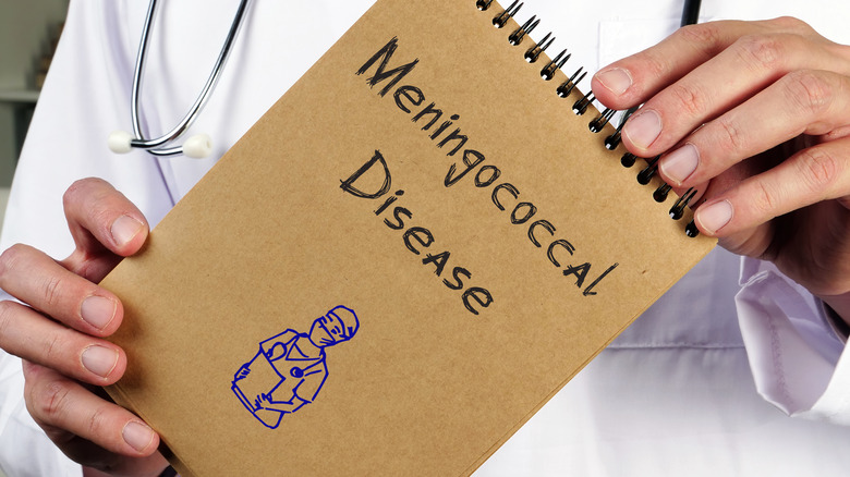 doctor with meningococcal disease on notepad