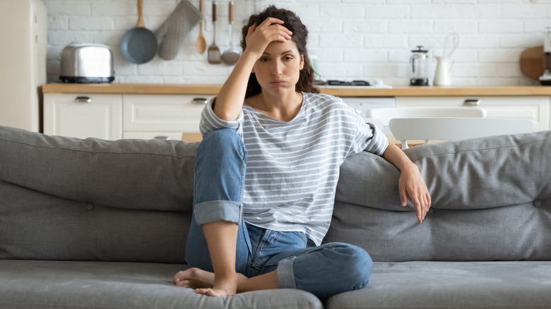 tired woman on couch