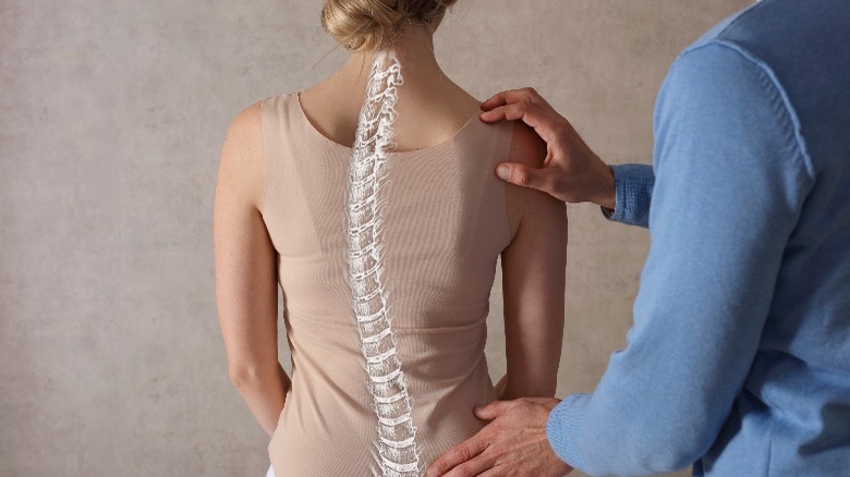 back exam with curved spine