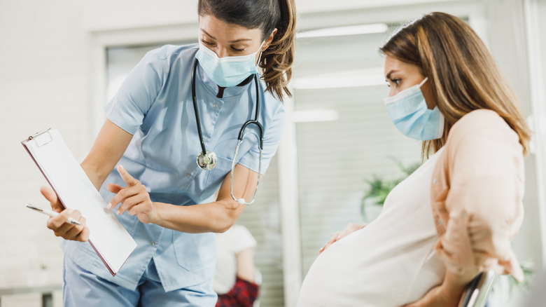 Pregnant woman and healthcare worker
