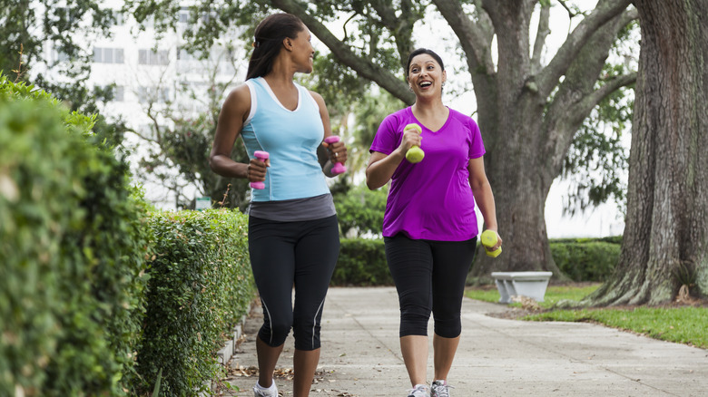 Smiling friends jogging