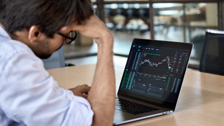 stressed-out man working on a computer