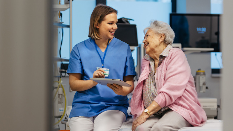 Nurse and patient smiling at each other