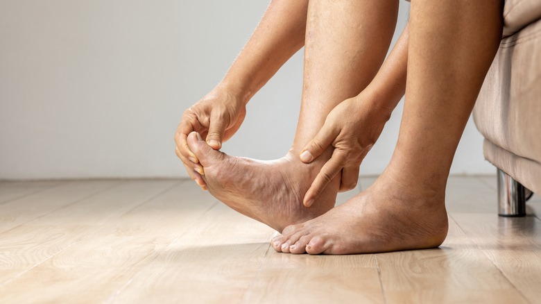 massaging the foot from a gout flare up