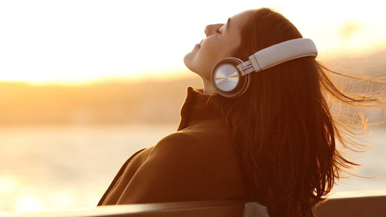 Woman relaxing to music