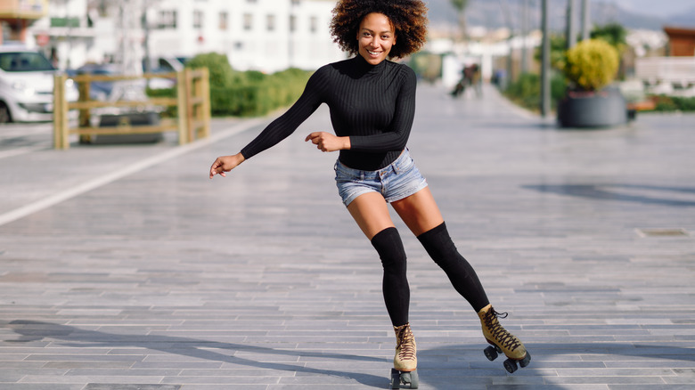 woman roller skating outside 