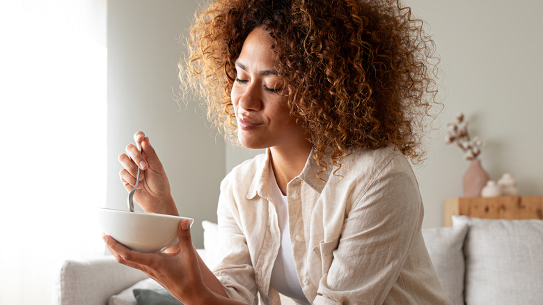 person hold bowl of food