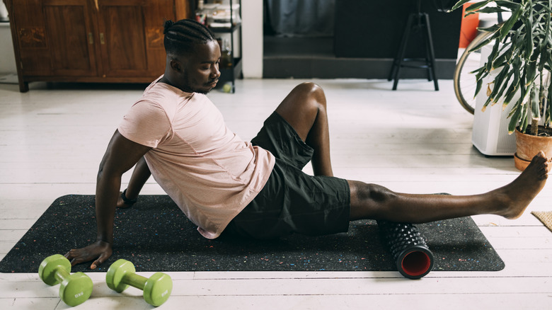 Man using a foam roller