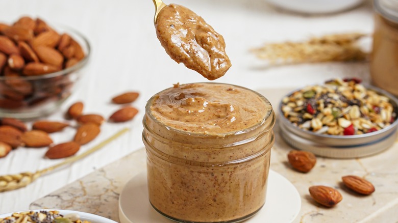 creamy almond butter in a jar