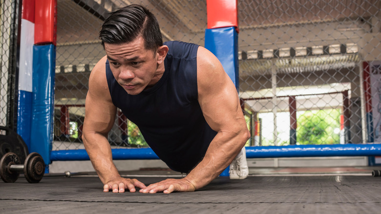 man doing diamond pushup