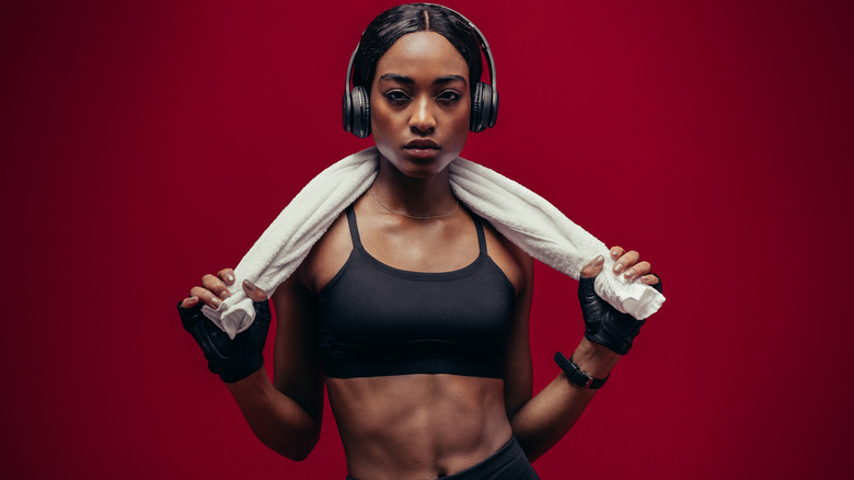 woman holding gym towel