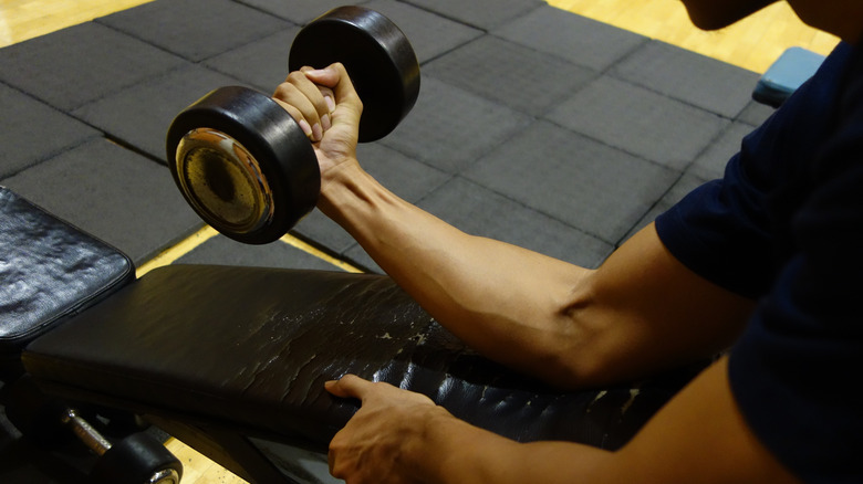 man doing wrist curls