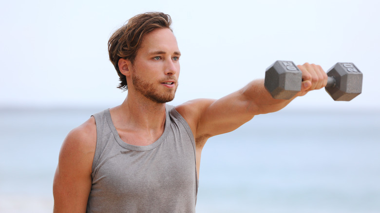 man doing front raises