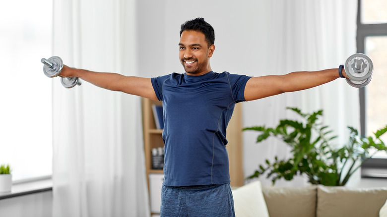 man doing lateral raises