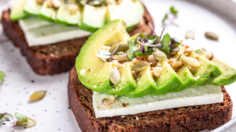 close-up of avocado toast with nuts